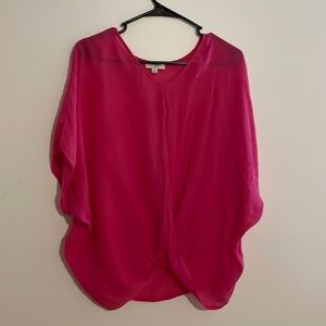 This dressy shirt is pink and see-through